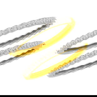 Pair of Two-Color Gold and Diamond Bangle Bracelets: 14 kt. yellow and white gold, 88 round diamonds ap. 3.50 cts., ap. 45 dwts. Inner cir. 6 9/16 and 6 7/16 inches. Diamonds: H-I-VS. Minor spots of patina to sides, scratches visible to sides.