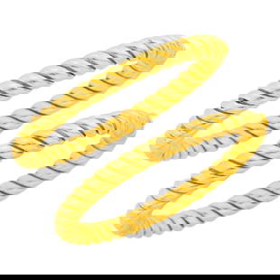 Van Cleef & Arpels Pair of Fluted Gold Bangle Bracelets: 18 kt., both signed V.C.A., nos. B2120, R133 and R134, with maker's marks, partially obscured, ap. 40.5 dwts. Inner cir. 6 1/4 inches. Widths 1/4 inch.