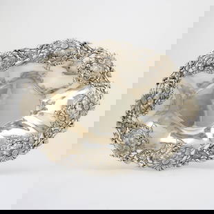 Gorham Sterling Silver Centerpiece Bowl: Shaped oval with applied floral border. Length 15 inches, approximately 23 ounces.  Generally good condition overall with spots of discoloration to body from use with flowers