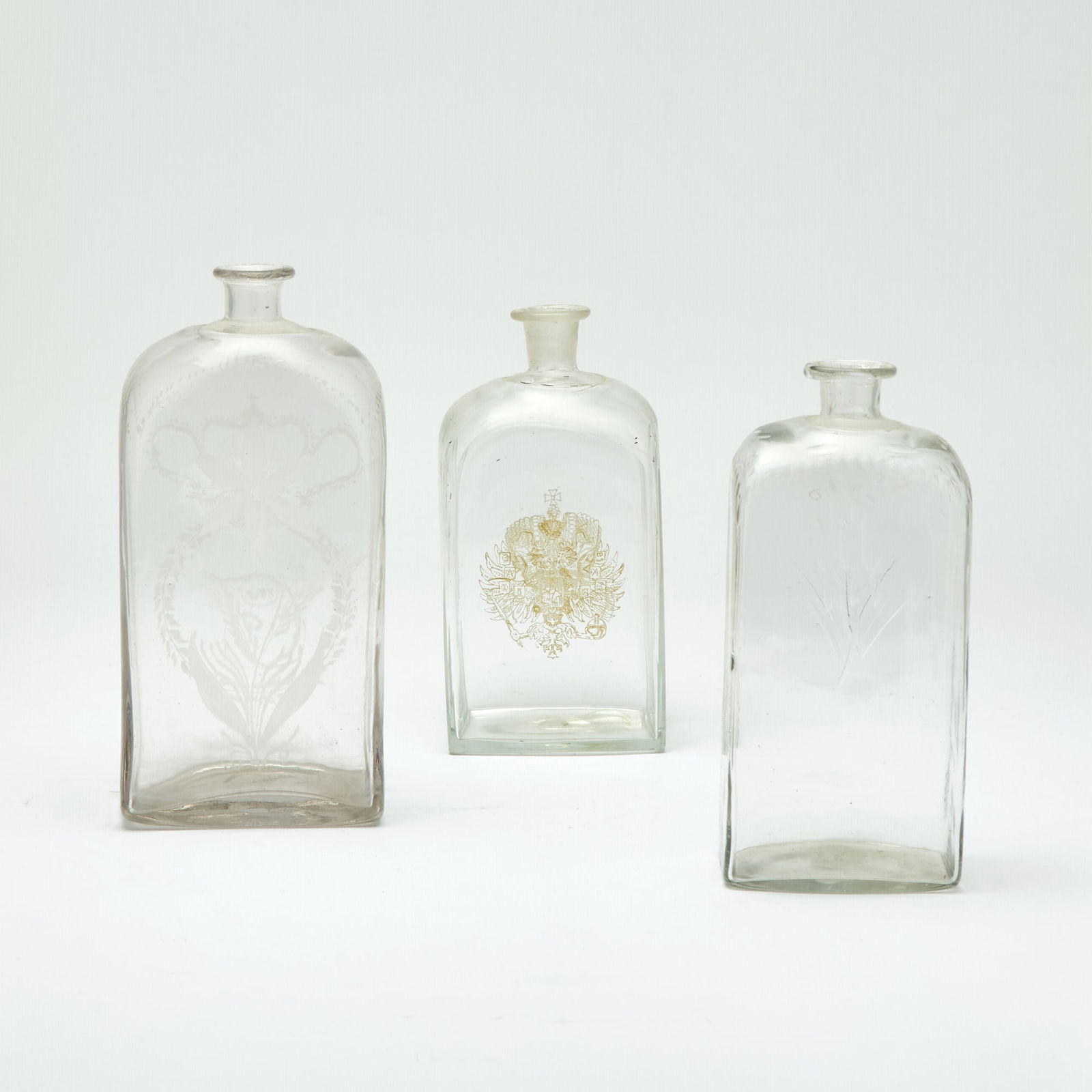 Group of Three Russian Style Glass Flasks: 20th Century Height of tallest 9 3/4 inches.