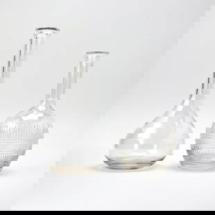 Pair of Baccarat Blown Glass Decanters: Lacking stoppers. Height of taller 11 3/4 inches.
