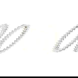 Pair of White Gold and Diamond Hoop Earrings: 56 round diamonds ap. 2.50 cts., ap. 8.6 dwts.  Tests as 18 kt. Diamonds: H-I-VS-SI. Posts with hinged back hoops. Diameters 1 3/16 inches. Widths just under 3/16 inch.