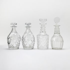 Group of Four Blown and Cut Lead Crystal Glass Decanters and Stoppers
