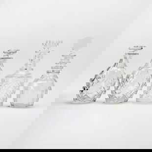 Group of Four Blown and Cut Lead Crystal Glass Decanters and Stoppers: Including a pair, each in colorless glass, unmarked. Height of tallest 11 5/8 inches.  each decanter and stopper appears to be in generally good, undamaged condition; no apparent chips,