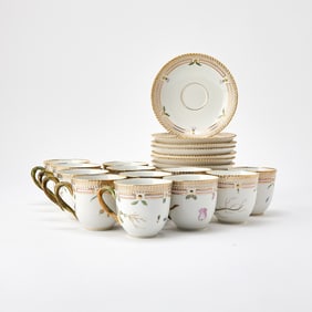 Twelve Royal Copenhagen Gilt and Hand-Painted Porcelain 'Flora Danica' Pattern Teacups and Saucers