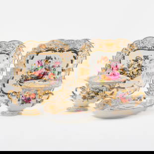 English Gilt and Hand-Painted Porcelain Partial Dinner Service: Comprising: Nine luncheon plates, diameter 9 1/4 inches Four shaped square dishes Four shaped oval dishes, length 11 1/2 inches  Three shaped circular dishes, diameter of largest 9 3/4 inches <