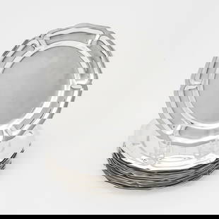 Set of Sixteen Mexican Sterling Silver Bread Plates: Each of circular form with a plain center, fluted border, and petaled rim, diameter 6 5/8 inches. Total approximately 64 ounces. (16)  each plate appears to be in generally good, undamag