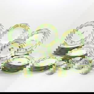 Hermès Porcelain 'Africa Green' Pattern Partial Dinner Service: Comprising: Sixteen dinner plates, diameter 10 7/8 inches Fifteeen salad/dessert plates, diameter 9 inches  Thirteen rim soup bowls, diameter 8 3/4 inches Circular serving bowl, height 2 1/4 inche