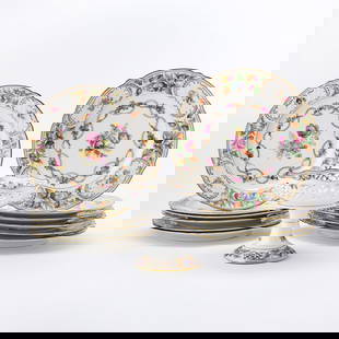 Group of German Transfer Decorated Porcelain Tableware: Schumann, 20th Century In various patterns and part sets, each with colorful floral decoration and gilt rims, comprising a set of six service plates, diameter 11 1/8 inches, and a dinner plate, diamet