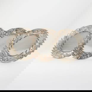 Set of Three Japanese Silver Dessert Plates: Samurai Shokai, Yokohama, early 20th century Each with a plain center continuing to a floral decorated border, signed. Diameter 8 1/4 inches. Total approximately 19 ounces. each p