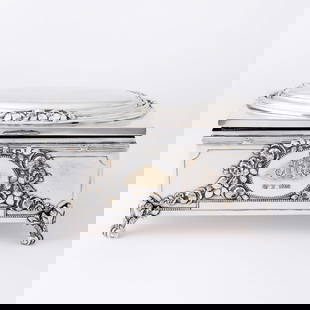 Continental Louis XVI Style Silver Plated Jewelry Casket: Early 20th century Rectangular, the front and reverse with oval medallion with cascade of flowers, raised on four scroll feet. Length 8 1/2 inches.  Generally good condition overal