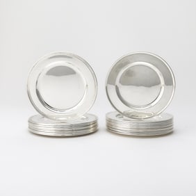 Set of Twelve Tiffany & Co. and Set of Eight Cartier Sterling Silver Bread Plates