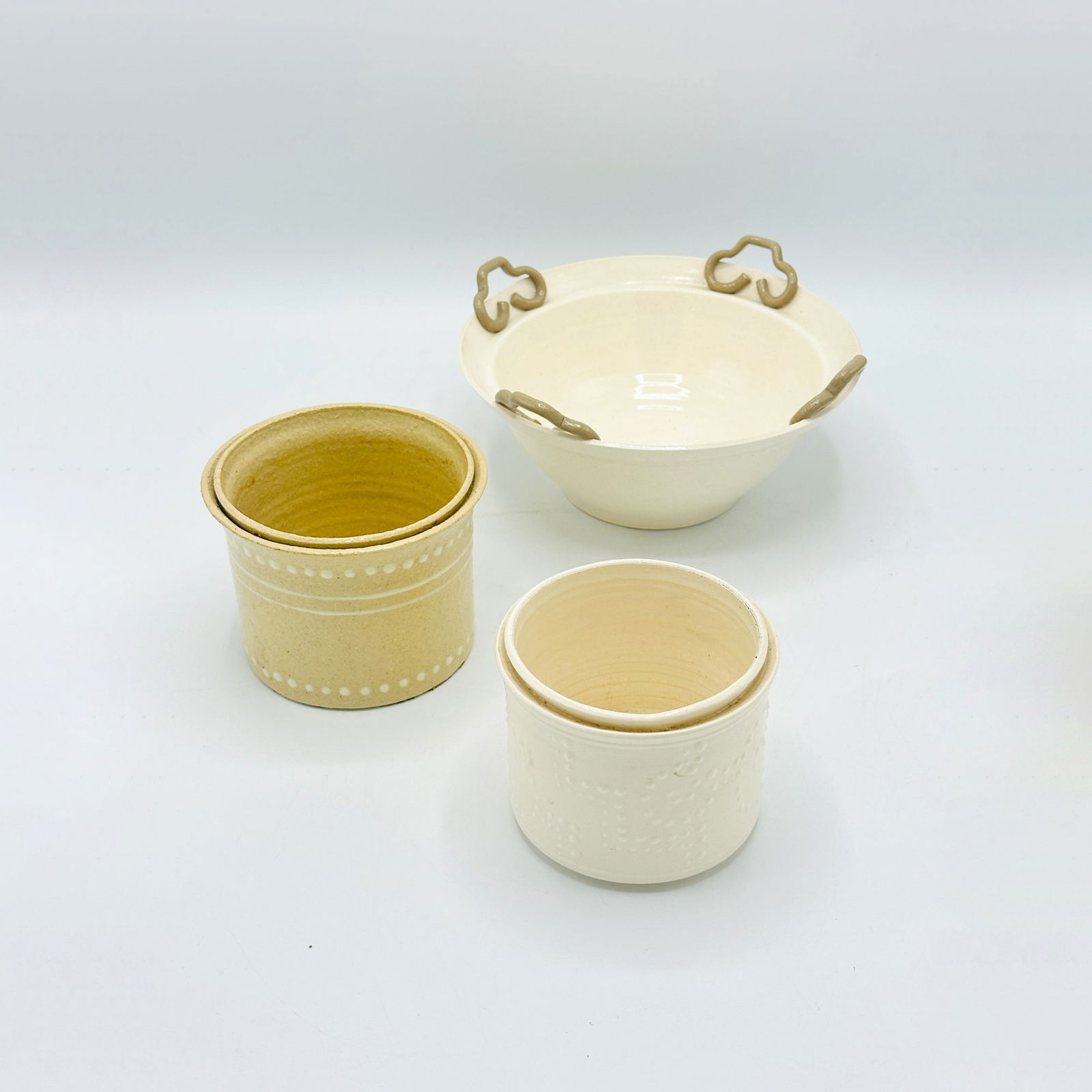 Group of Three Roy Hamilton Pottery Table Articles: Including two flower pots and a bowl with applied handles. Flower pots with inscription Roy Hamilton especially for Wm. Hodgin Inc. Diameter of bowl 8 3/4 inches.