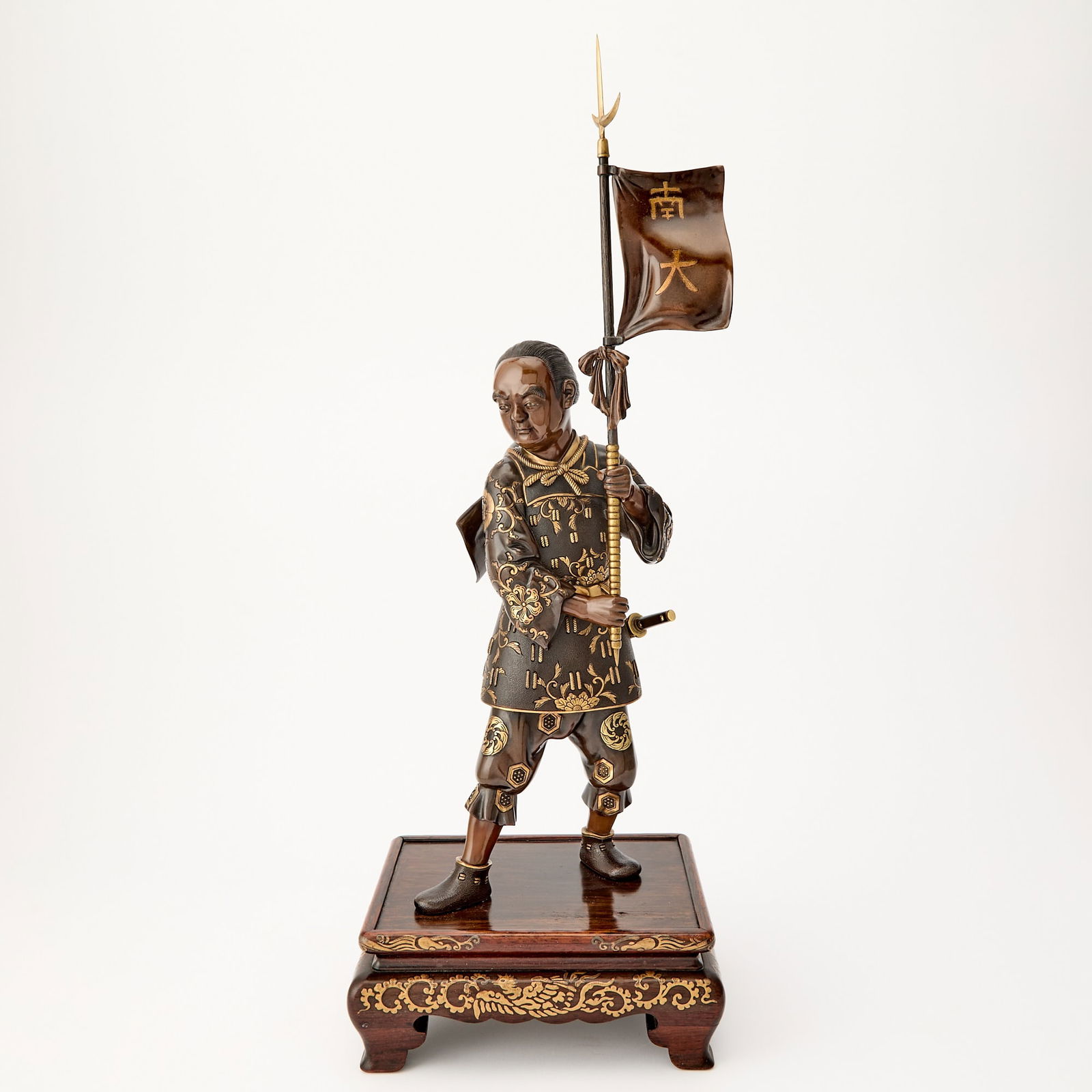 A Japanese Parcel Gilt Bronze Figural Sculpture of a Standard Bearer Signed Miyao, Studio of Miyao (1 of 4)
