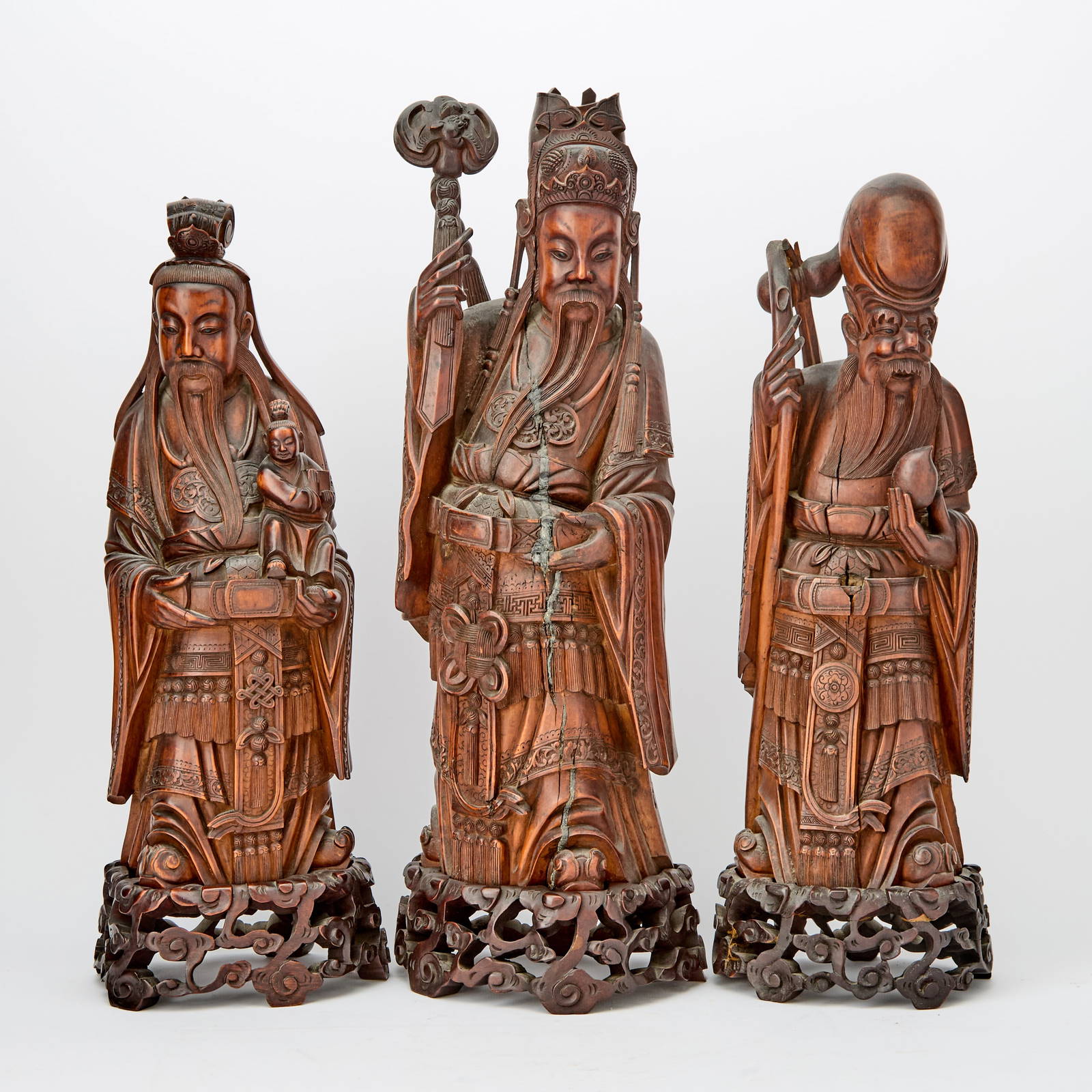 A Group of Chinese Carved Wood Figures of Fu, Lu, and Shou 19th century