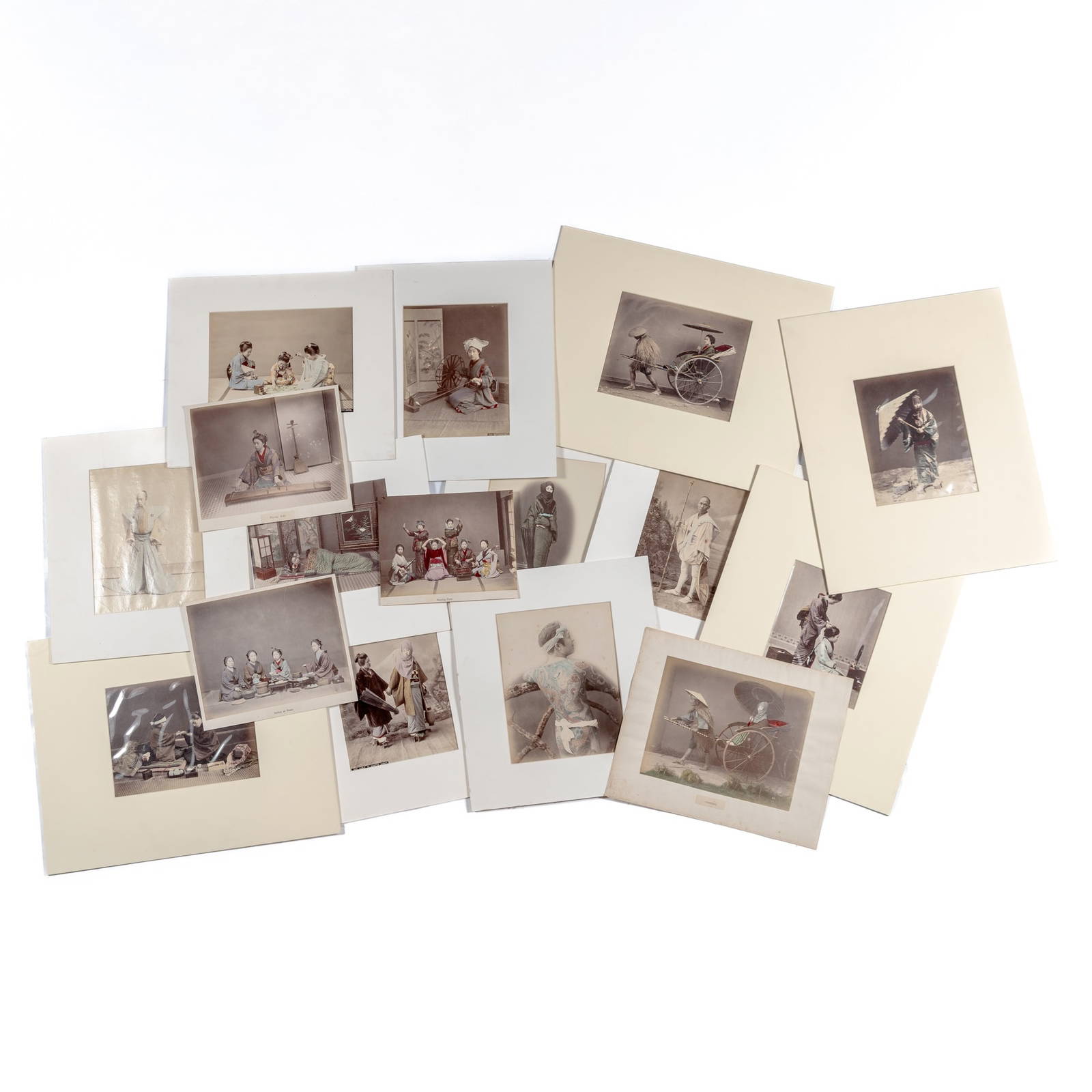 A Group of Japanese Studio Albumen Photographs Depicting Figural Subjects Meiji Period