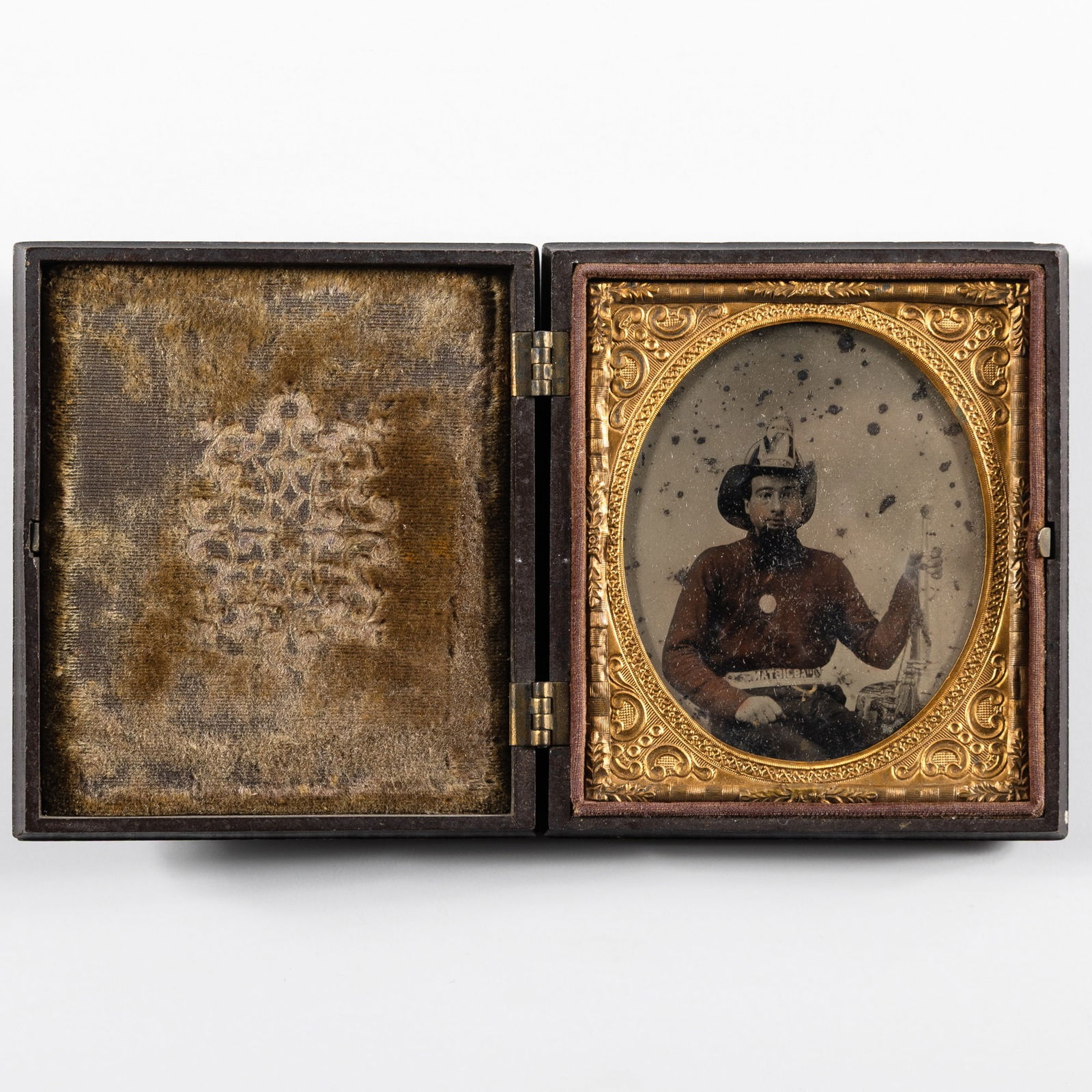 An unusual Ambrotype of a fireman in a spectacular case