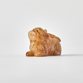 A Chinese Mottled Jade Carving of a Pixiu