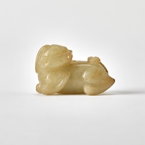 A Chinese Celadon and Russet Jade Beast Ming Dynasty or Later