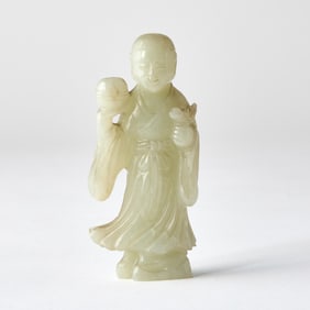 A Chinese Celadon Jade Carving of a Boy Qing Dynasty