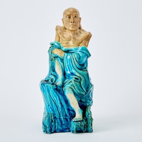 A Chinese Turquoise Glazed Biscuit Figure of a Luohan 19th Century