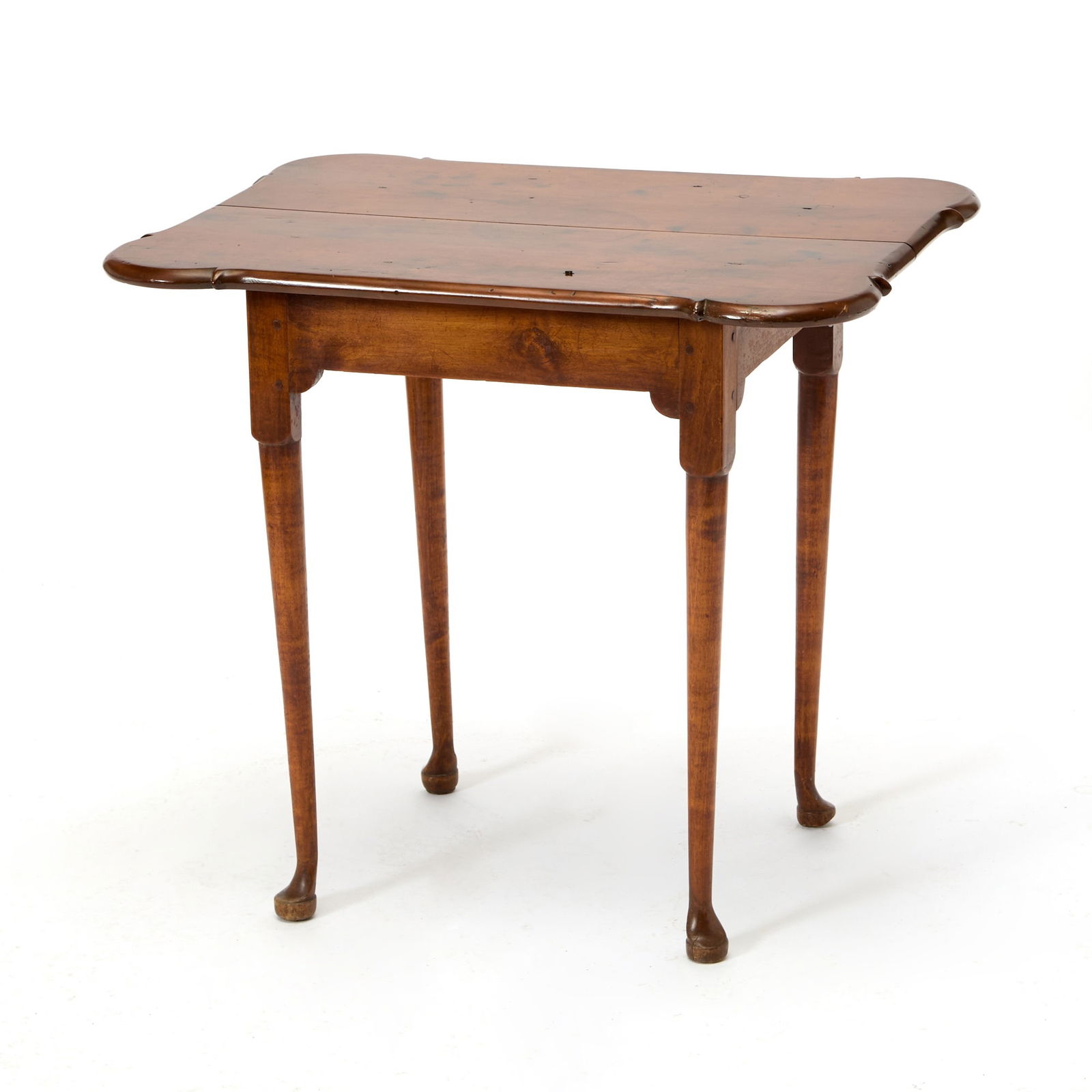 Queen Anne Maple and Pine Porringer-top Tea Table: New England, mid-18th century The top on a shaped apron joining block turned tapered legs ending in pad feet, refinished. Height 27 inches, width 30 1/2 inches, depth 23 1/2 inches. Please note: This