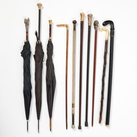 Group of Canes and Umbrellas Together with a Brass Stand