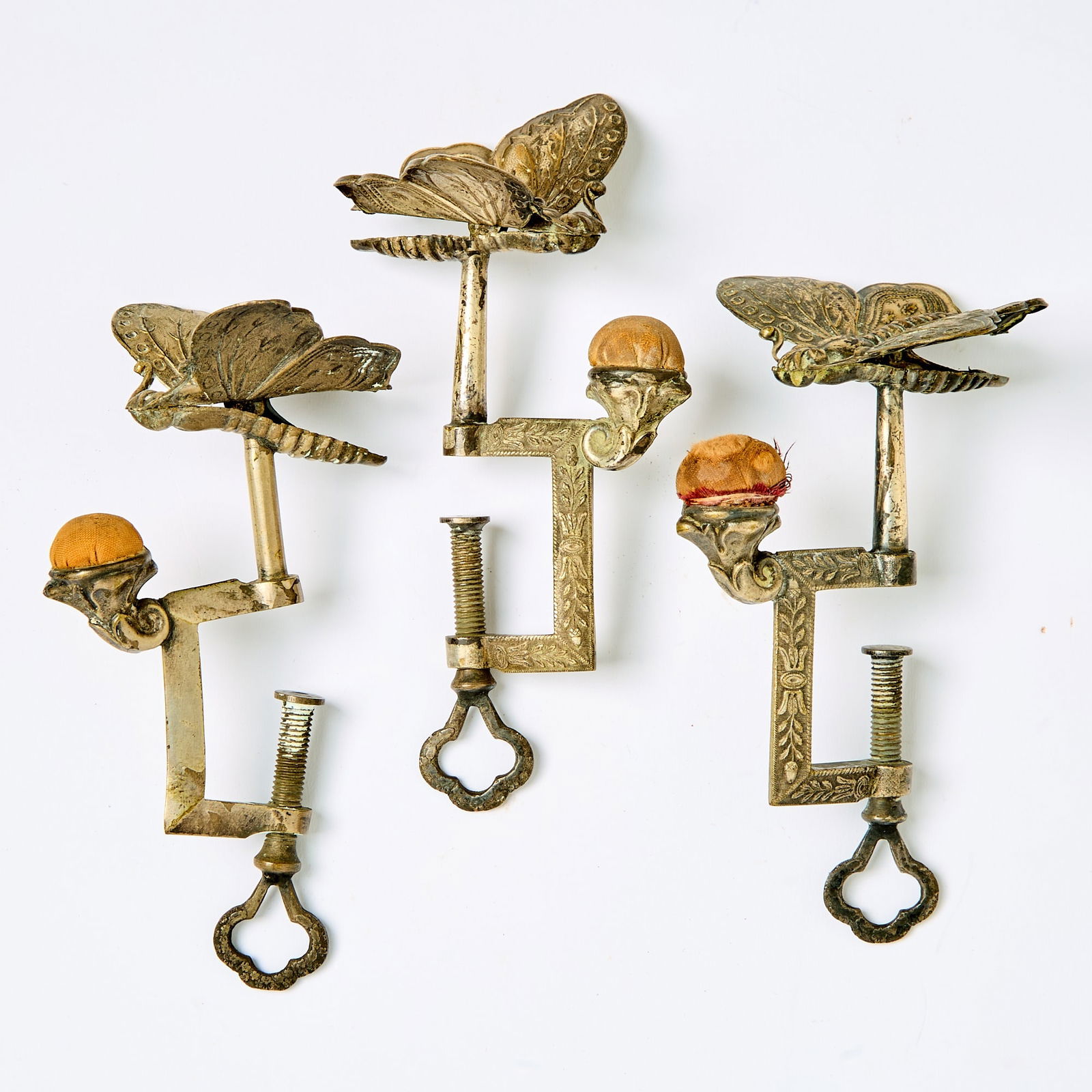 Three Silvered Metal and Brass Butterfly Sewing Clamps with Pin Cushions (1 of 4)