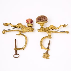 Two Gilt Brass Dolphin Sewing Clamps with Pin Cushions