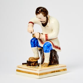 Russian Porcelain Figure of a Bast Shoemaker