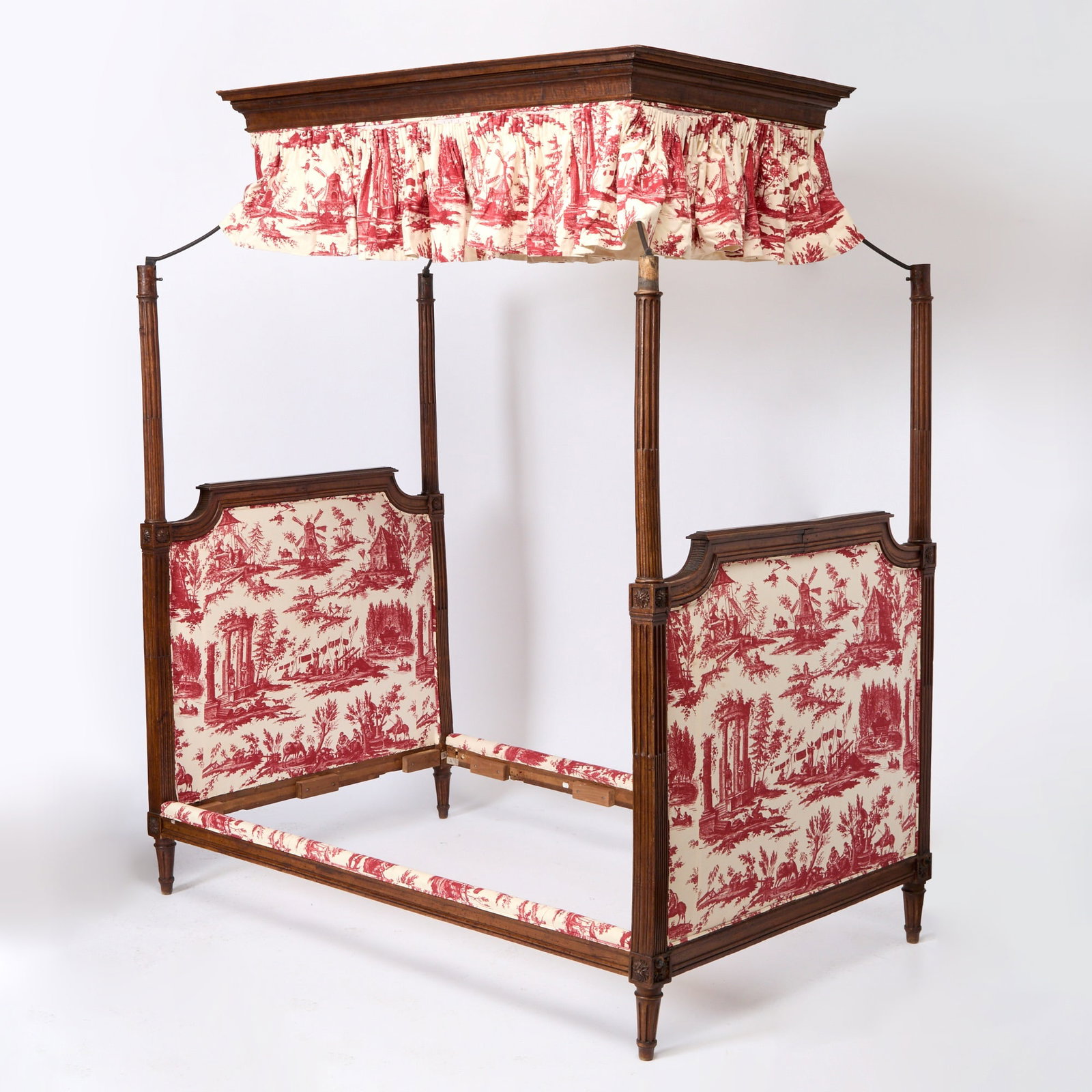 Louis XVI Beechwood Canopy Bedstead: Late 18th century Each arched headboard on stop-fluted supports and tapering legs, overall upholstered in a red and white toile, height 97 1/2 inches (247.6 cm), width 80 3/4 inches (205.1 cm), depth 