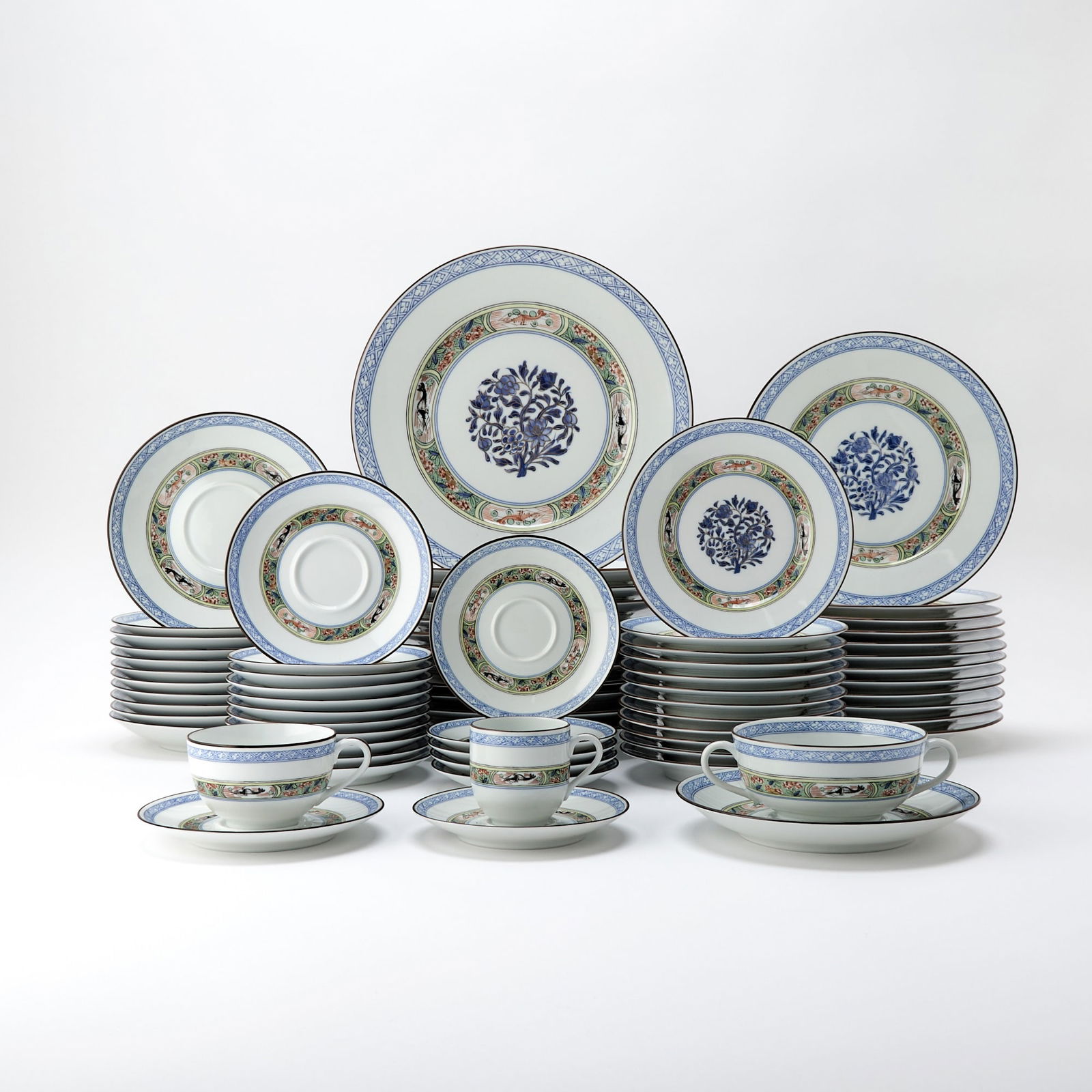 Puiforcat Porcelain "Kan Sou" Pattern Dinner Service: Comprising: Twelve dinner plates, diameter 10 7/8 inches Twelve luncheon plates, diameter 9 inches Twelve salad/dessert plates, diameter 7 inches Twelve coffee cups Twelve teacups Twel