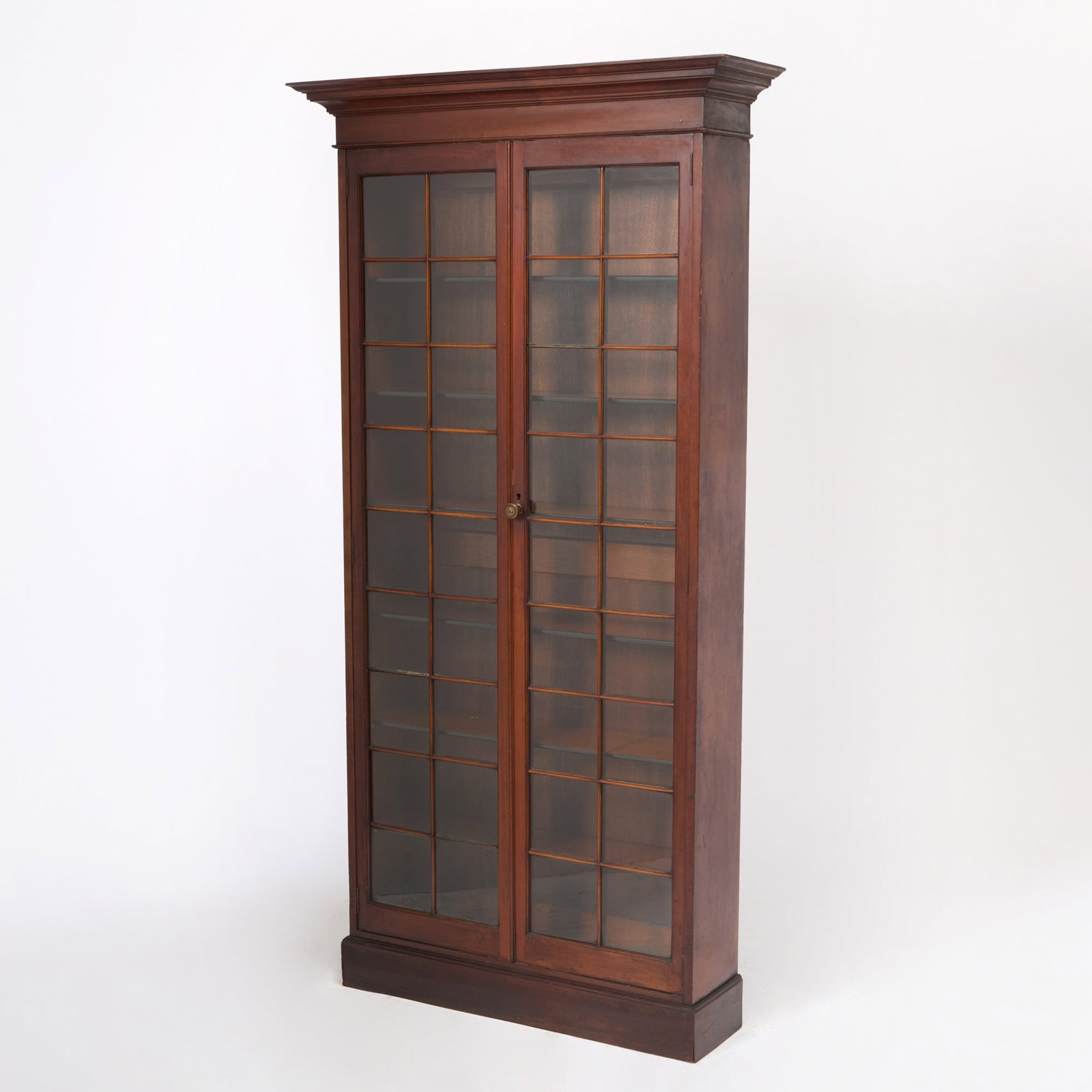 George III Style Mahogany Bookcase: 20th Century Height 7 feet, width at cornice 42 1/2 inches, depth of cornice 11 3/4 inches.