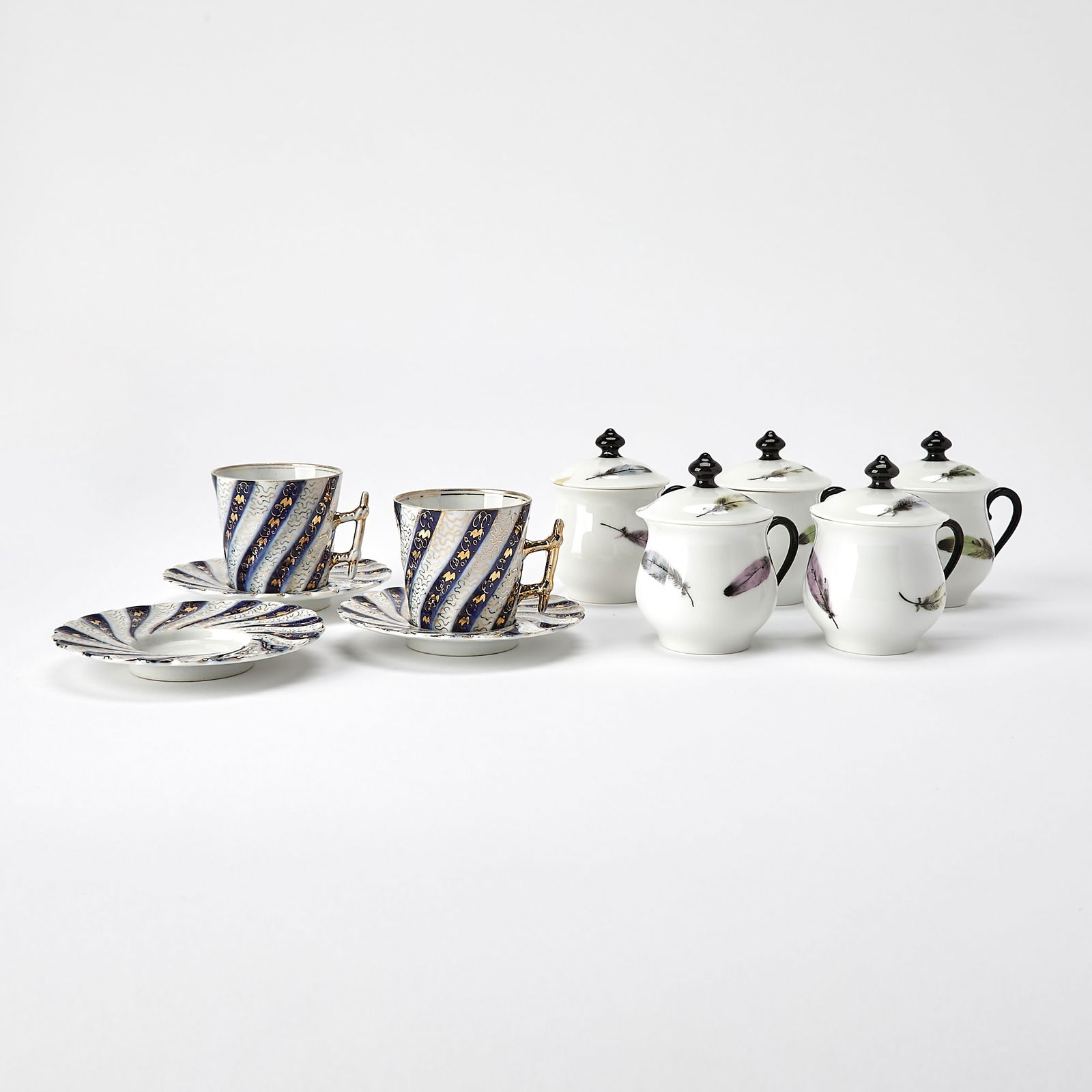 Five Pieces of Nymphenburg Blue and White Teawares: Comprising two demitasse cups and three saucers, diameter 4 1/8 inches. Together with Five Limoges Pot de Cremes, height 3 1/4 inches. Provenance: Duke and Duchess of Windsor Sale, Soth