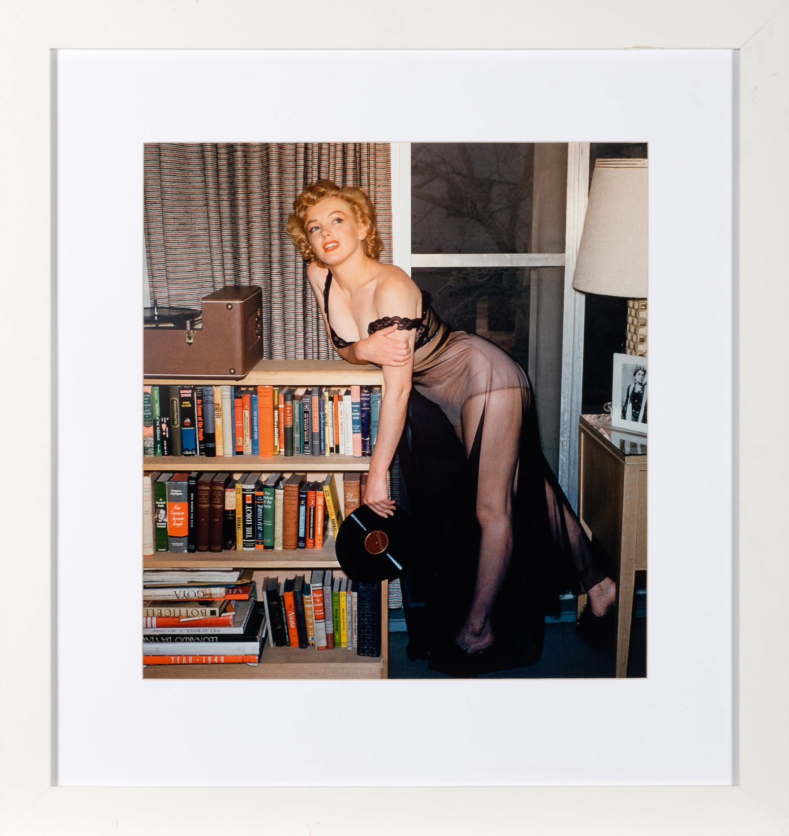 Marilyn Monroe by Harold Lloyd: HAROLD LLOYD Marilyn Monroe, 1952. Later chromogenic print, 16 x 17 inches. Dry mounted in frame. No obvious defects under raking light. A stunning photograph of Marilyn Monroe at home