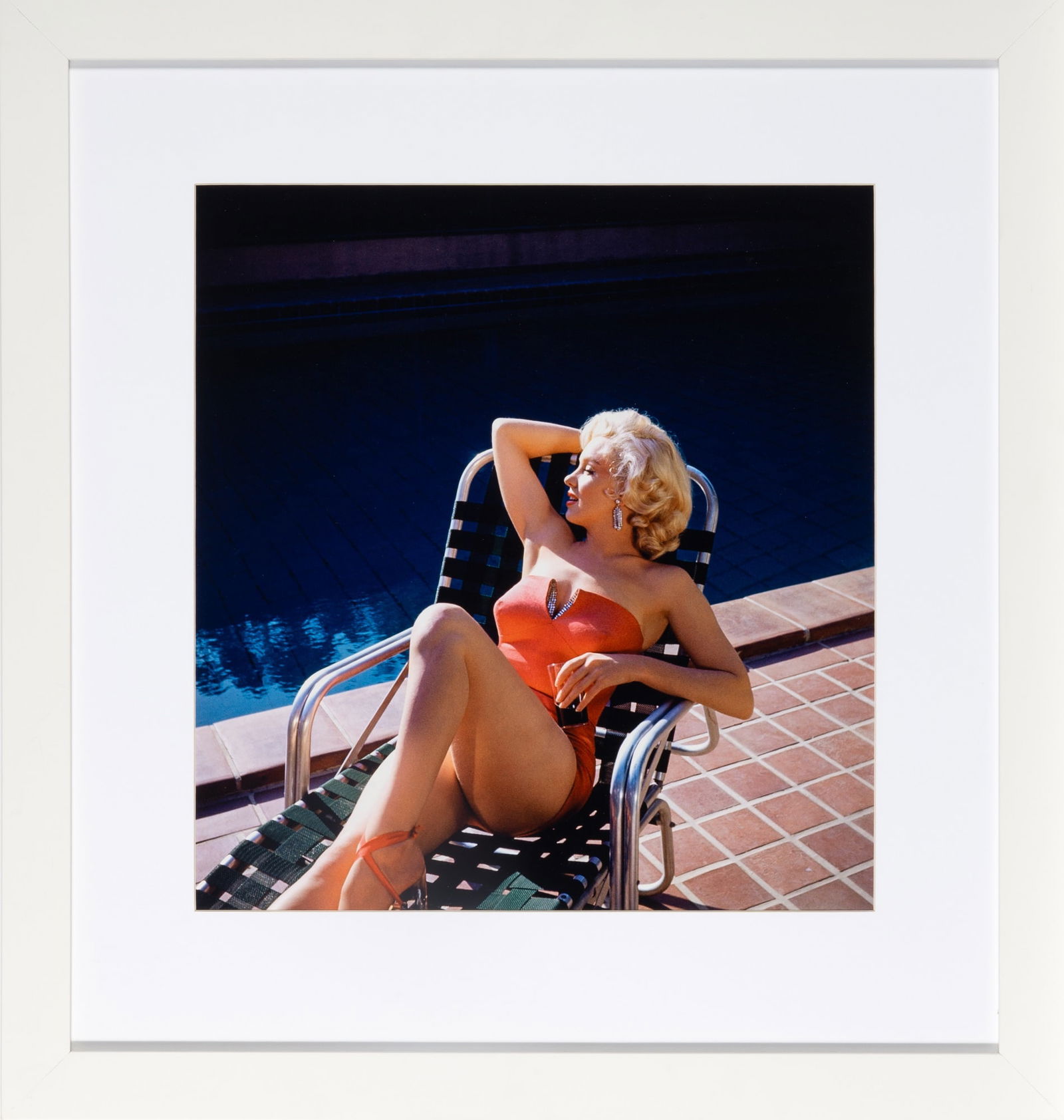 Marilyn Monroe by Harold Lloyd: HAROLD LLOYD Marilyn Monroe, 1953. Later chromogenic print, 16 x 17 inches. Dry mounted in frame. No obvious defects under raking light. Not examined out of frame. An iconic poolside p