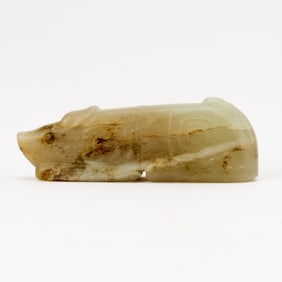 A Chinese Celadon Jade Pendant of a Recumbent Beast Ming Dynasty