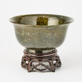 A Chinese Spinach Jade Footed Bowl with a Wooden Stand 20th Century