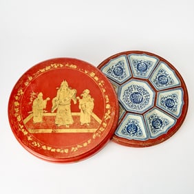A Chinese Gilt decorated Red Lacquer Box with Porcelain Sweetmeat Dishes 19th century