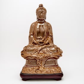 A Chinese Cafe au Lait Glazed Porcelain Figure of Shakyamuni 19th-20th Century