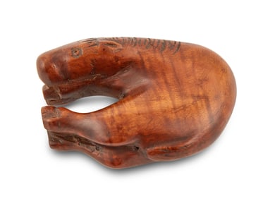 A Japanese Carved Wooden Netsuke of a Horse Edo Period