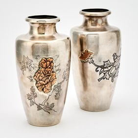 A Pair of Japanese Silver Vases Decorated with Peony Flowers and Melon Tendrils Signed Nomura