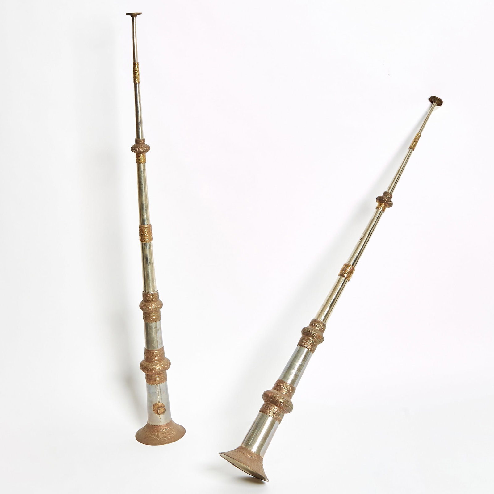 Pair of Tibetan Metal Trumpets: Height 23 1/2 inches (59.6 cm). Some dings and dents.