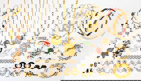 Group of Gold, Gilt-Metal and Rhinestone Costume Jewelry: Including necklaces, bracelets, earclips, rings and brooches, two earclips signed Ciner and Joan Rivers, one bangle signed Kenneth Lane, one gold and coral necklace fragment, gold ap. 35 dwts. gross.