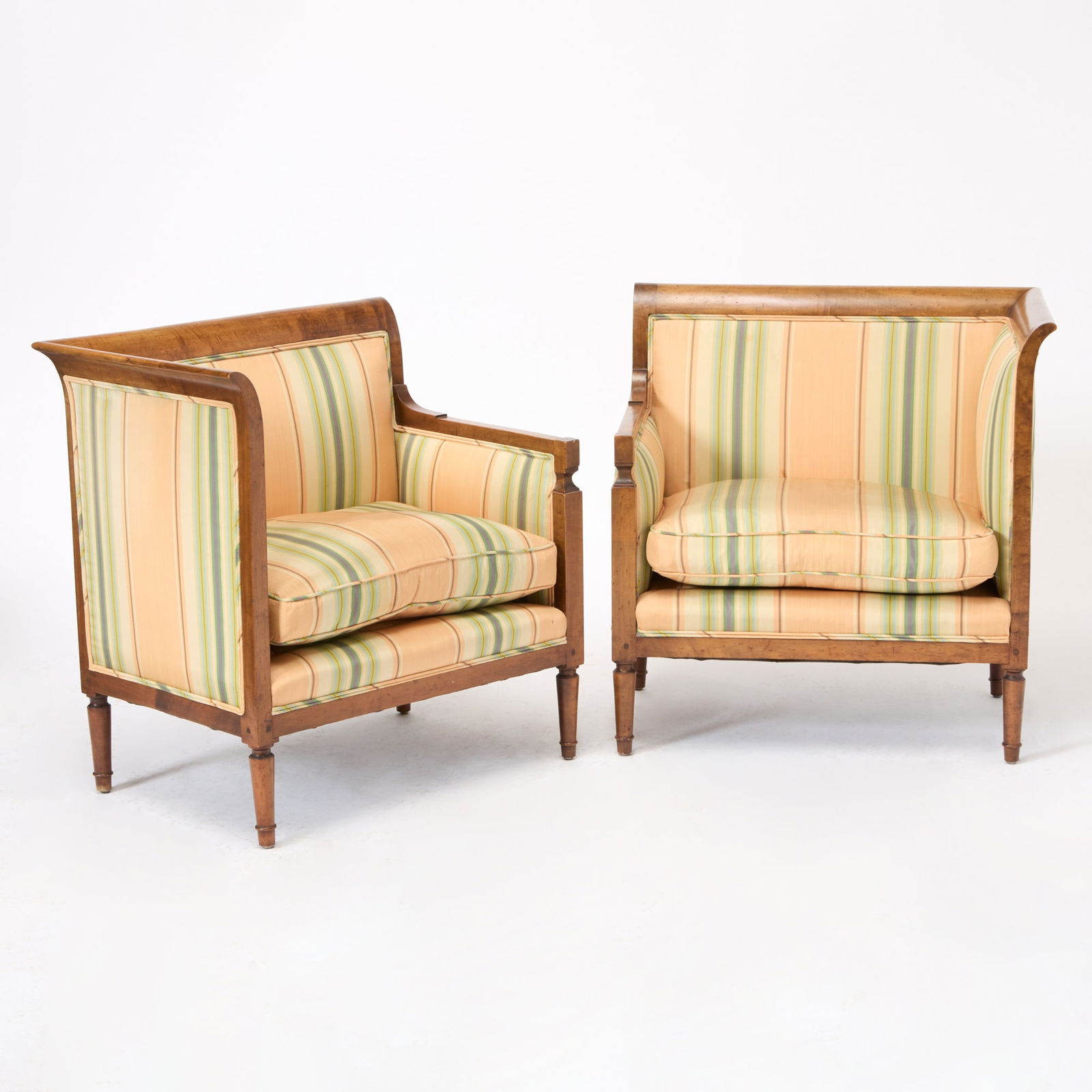 Pair of Italian Neoclassical Style Upholstered Walnut Armchairs: Mid-20th Century Height 31 inches, width 32 inches, depth 28 1/2 inches. Worn finish, fabric shows signs of use with small spots