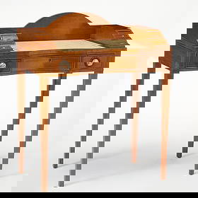 American Maple Ladies Desk: 20th entury Labeled "Sohon, NY Tradition Furniture." Leather inset gilt tooled leather top, brass and porcelain drawer handles. Height 36 inches, width 30 inches, depth 17 inches. light scratches on