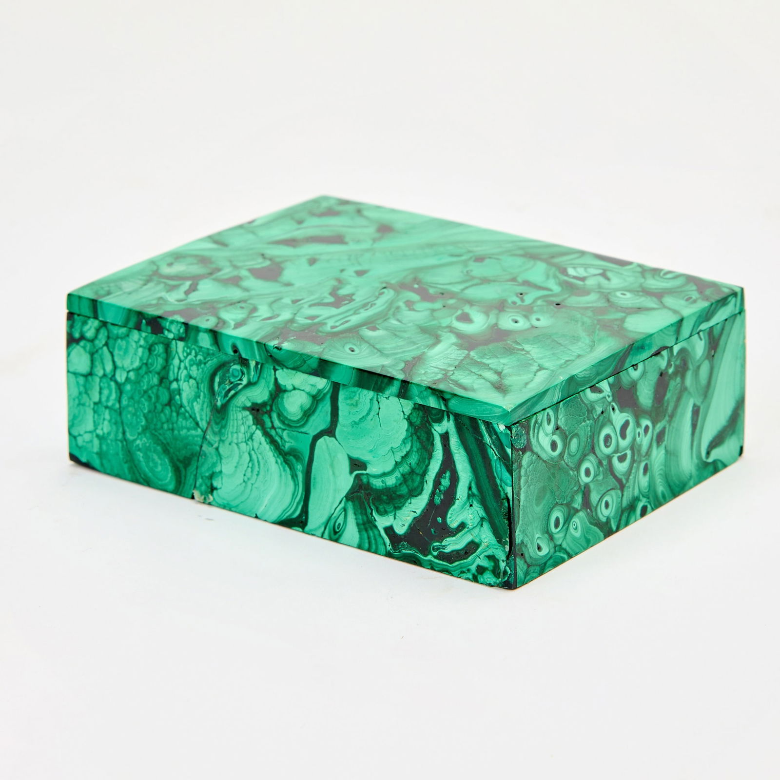 Malachite Box: Late 20th century With a loose cover. Height 1 5/8 inches, width 4 3/4 inches, depth 3 3/8 inches. chipped edges