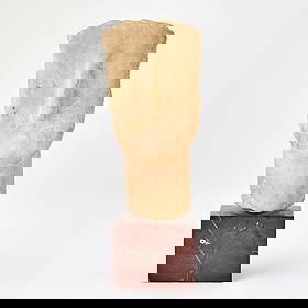 Greek Large Cycladic Marble Head: Early Bronze Age II, circa 2600-2400 B.C. An impressive size abstract head, originally from a full figure which would have been of a very important stature; the oval head slopes back rising from a thi