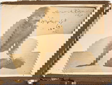 An early photograph of Gandhi with his signature inset