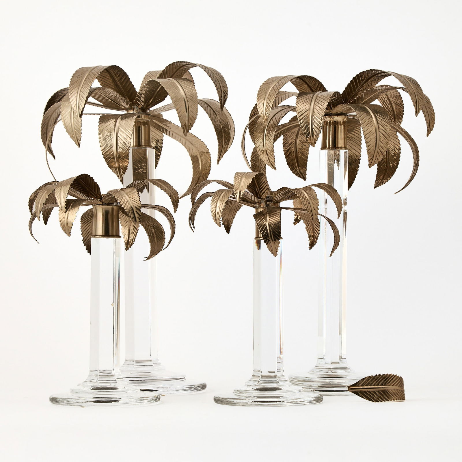 Two Pairs of William Yeoward Metal and Glass Palm Tree Form Candlesticks: Height of taller 15 inches, height of shorter 10 inches.